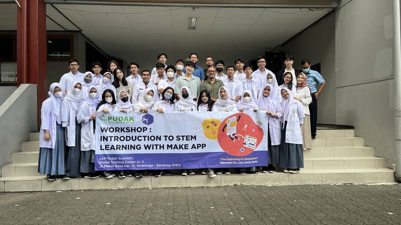 Students coding on laptops